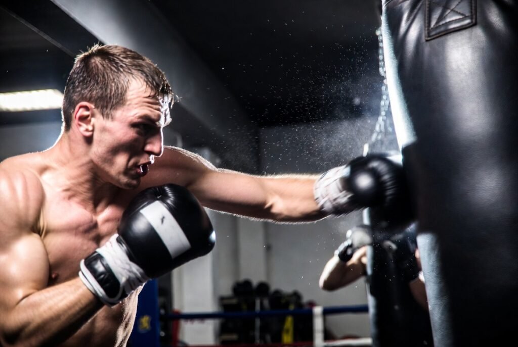 How to Improve Punching Speed and Power Complete guide 1 ## ALT TextBoxer throwing a powerful fast punch during intense boxing speed and power training session in a professional gym