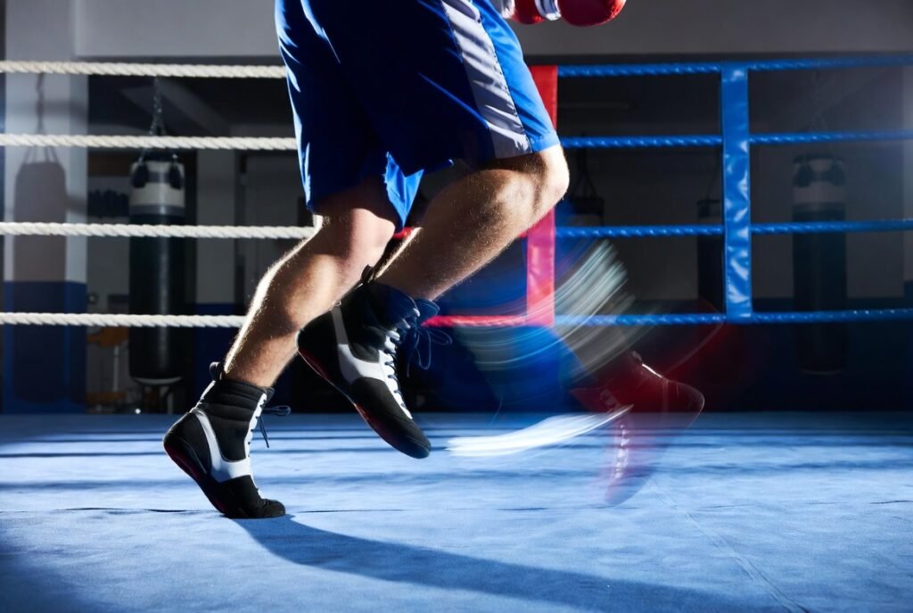 When Should You Switch to Boxing Shoes? 7 Clear Signs 1 ## 🖼️ ALT Text (SEO Optimized)Boxer performing fast footwork drills inside a boxing ring while wearing boxing shoes, showing agility, balance, and controlled movement during professional boxing training in a modern gym.